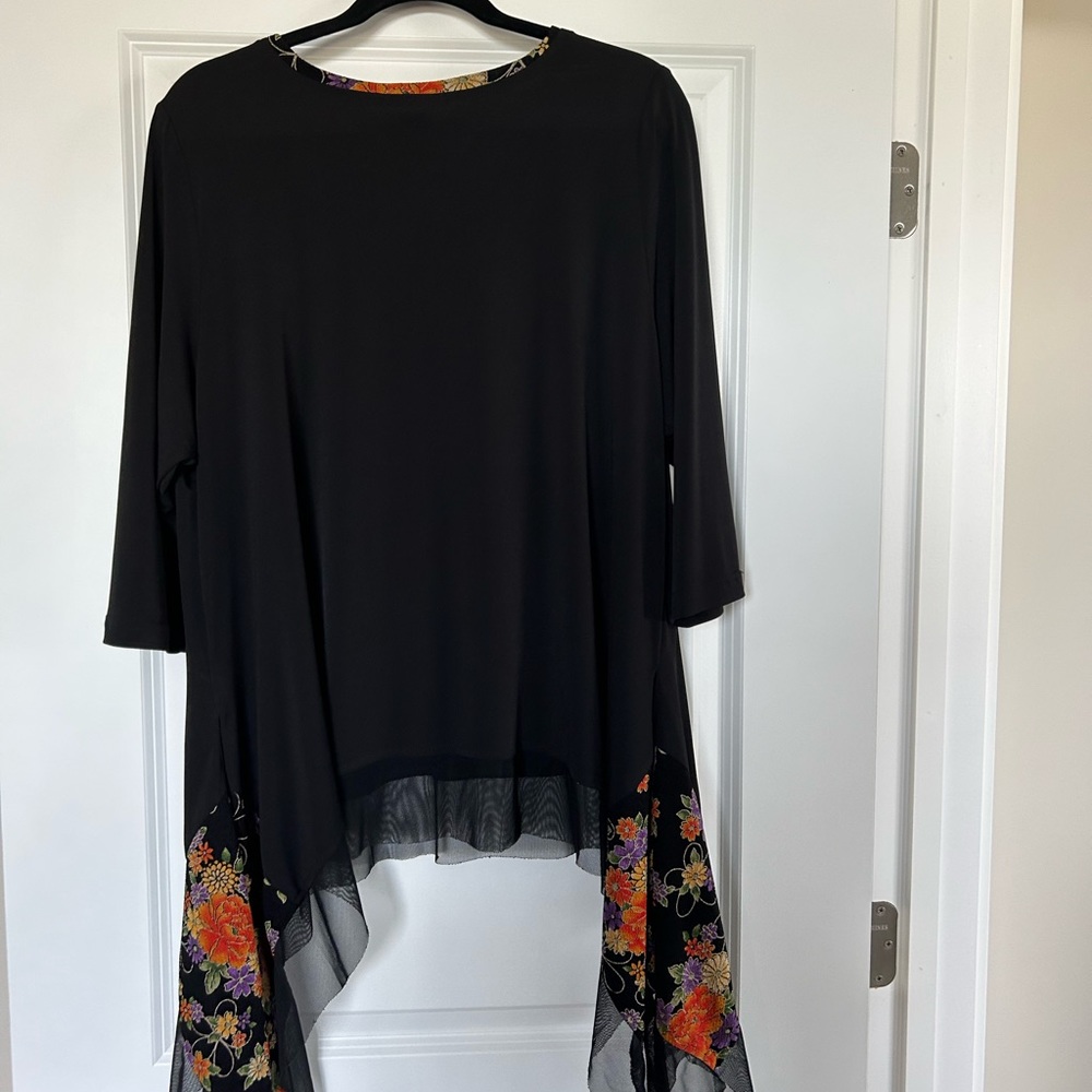 Black top with floral trim. - Picture 2 of 9